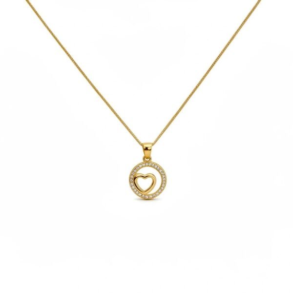 "Cuore di Luce" Where love softly shines. The Cuore di Luce Necklace is a graceful expression of love and quiet elegance. Crafted in radiant gold plating, this delicate round pendant features an open heart at its center, framed by a shimmering halo of crystals that softly catch the light. Symbolizing love, warmth, and connection, the open-heart design feels both modern and timeless. The surrounding crystal accents add a refined brilliance, creating a piece that feels light, romantic, and effortlessly wearable. Designed to be worn close to the heart, the Cuore di Luce Necklace transitions seamlessly from everyday moments to special occasions. Whether worn alone for understated elegance or layered with other Bella Pia favorites, it is a meaningful keepsake that celebrates love in its purest form.